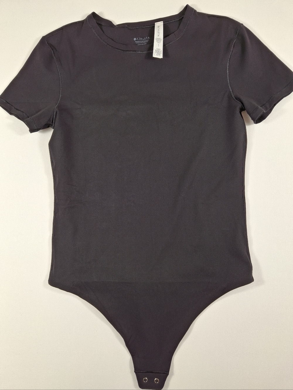 Athleta Black Short-Sleeve Bodysuit Neckline With Snap Closure Size S